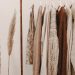 winter capsule wardrobe sweaters hanging on a rack