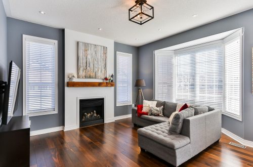Living Room with dark Hardwood Floors and minimalist staging