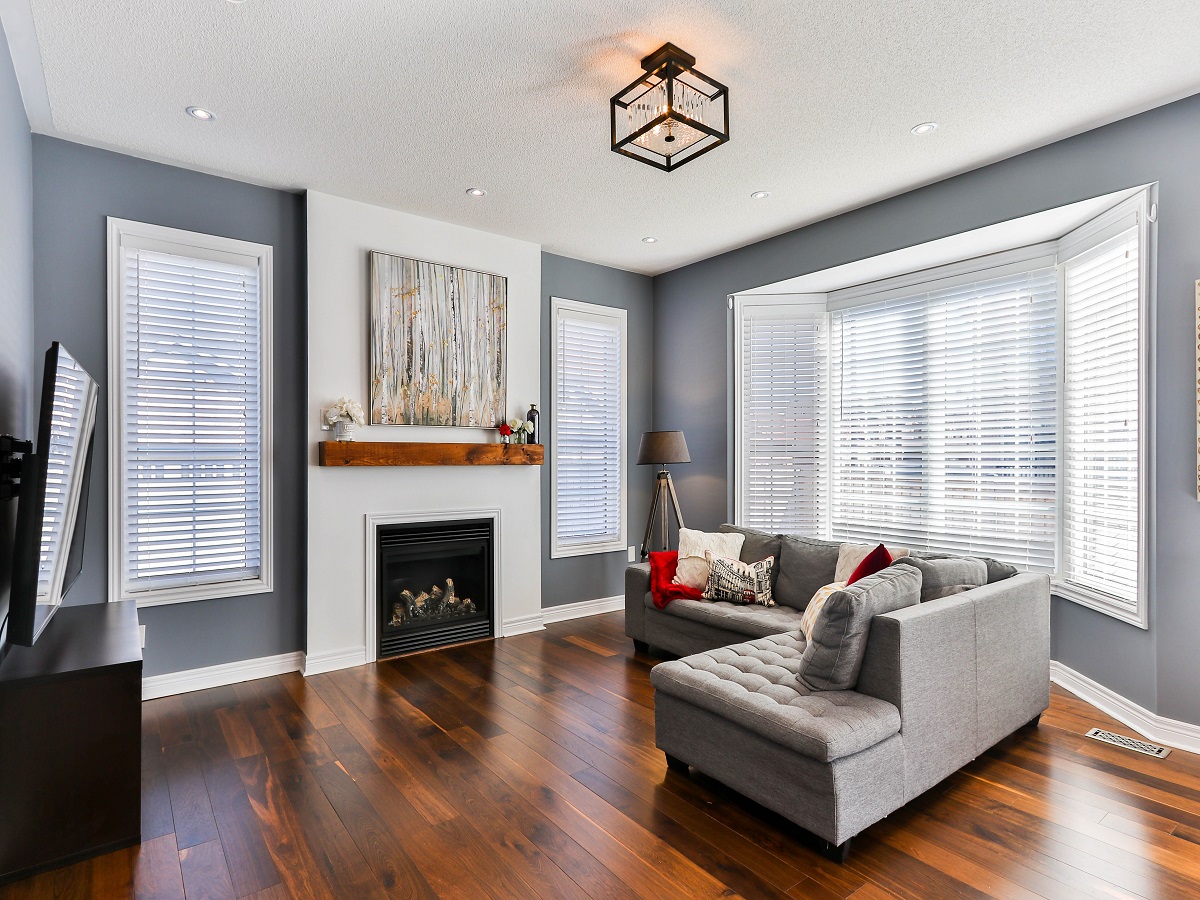 Living Room with dark Hardwood Floors and minimalist staging