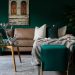 green and gold living room decor with green couch and green walls