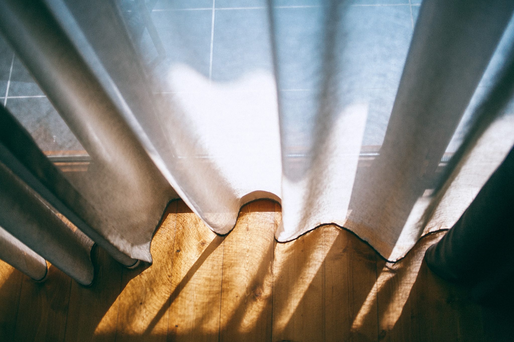 Drapes vs Curtains and Should Your Curtains Touch the Floor?