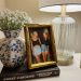 bedside table decor ideas, nightstand decor ideas, night stand decor, nightstand decor style, nightstand decor lamp and photo frame with friends and book and flowers.