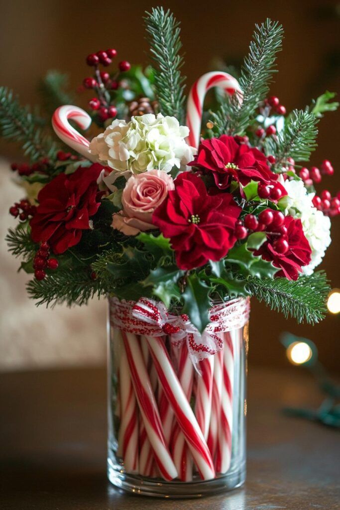 Festive Christmas table centerpieces featuring flowers and peppermint sticks in a rustic mason jar.