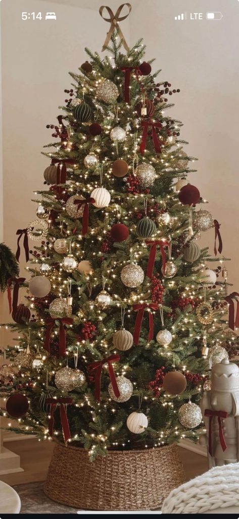 Elegant Christmas tree styled in a classic Ralph Lauren Christmas-inspired design with rich colors timeless ornaments and sophisticated holiday accents perfect for upscale Christmas decor ideas for the home.