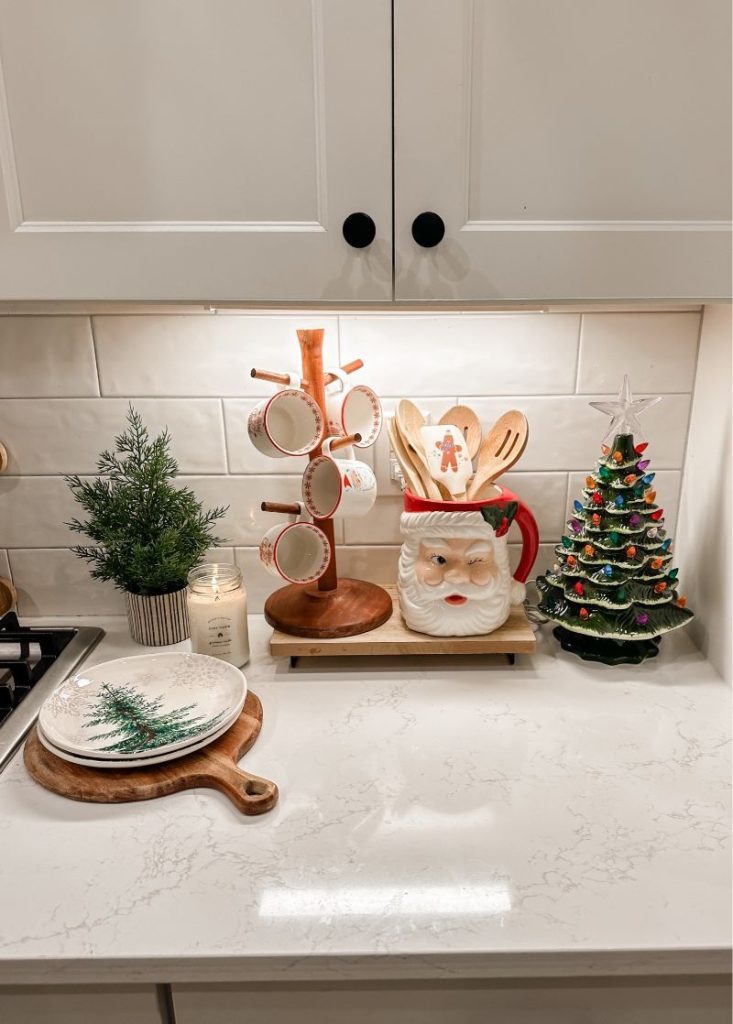 Festive Santa decor on a modern kitchen counter — cozy and minimalist Christmas home styling on a budget from By Paige Nicole.